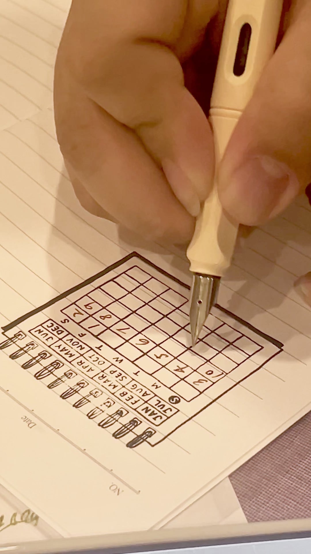 writing on printed stamp preinked by midori date painted habit tracker